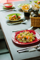 Meatball with cheese, vegetables and pasta.
