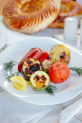 White plate with grilled vegetables.