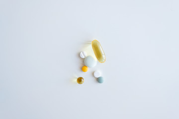 Handful of pills on white background