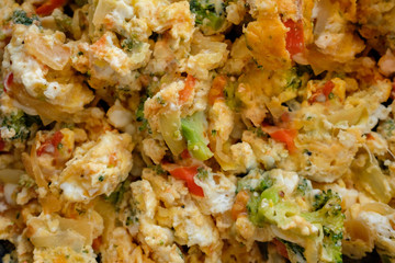 Omelette with vegetables filling the whole frame.