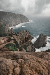 Seascape Rocky coast near the ocean in cloudy weather. Cape Roca in Portugal