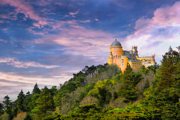 Pena Palace in the city of Sintra Portugal against the backdrop of a bright sunset