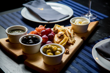 olives cheese grapes sauce snacks in resturant