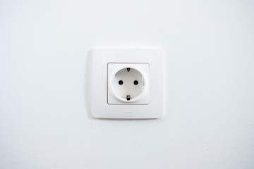 White socket on the white wall