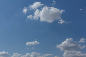 The blue sky and white clouds indicate pure and freshing