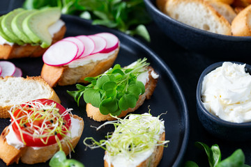 toasted breads of baguette with cream cheese and vegetables