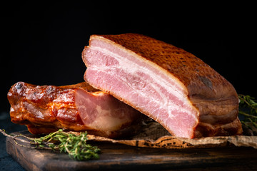 Homemade smoked bacon whole piece on wooden Board. Fat Pork Brisket on ribs - obrazy, fototapety, plakaty