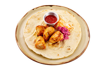 Plate with chicken meat shashlik - traditional barbecue meal served with lavash and ketchup isolated at white background.