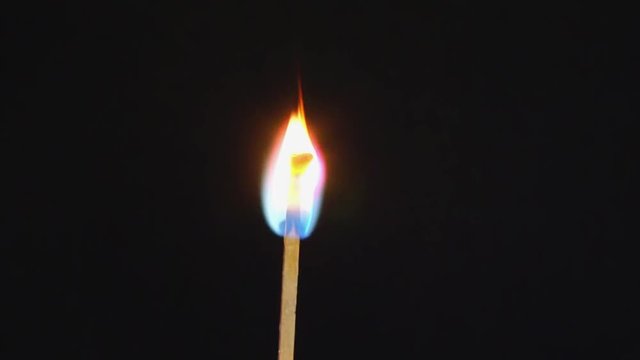 vertically burning match