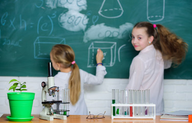 Educational research. Elementary school children in research laboratory. Microscope and laboratory equipment. Science research laboratory for school and education. Research and training