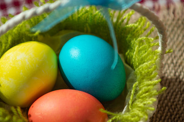 Three Easter eggs in a basket