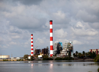 Fototapeta na wymiar Cuba. Industrial factory buildings by the sea