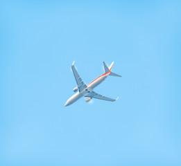 A plane flying in the sky.