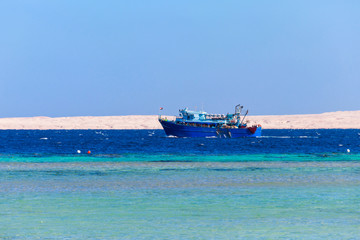 Fishing trawler sails at Red sea in Hurghada, Egypt