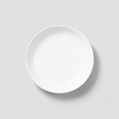 Empty porcelain white plate isolated on white background