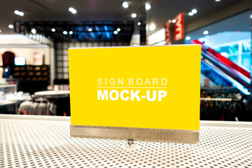 Mock up signboard with acrylic frame in clothing shop