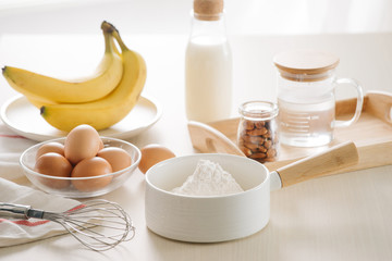 ingredients and tools to make a cake, flour, butter, sugar,eggs
