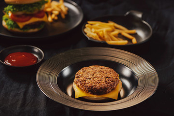 Fresh Tasty burger on dish with with french fries, ketchup