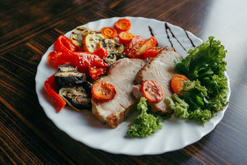 Grilled pork and pumpkin on a grill pan