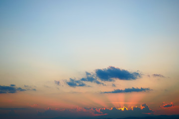 light rays of sun above clear blue sky