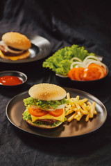Homemade burger and cheese with fries and icy soft drink
