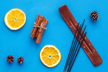 incense sticks with citrus and cinnamon for fresh air on white background top view