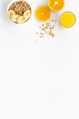 food for healthy breakfast with granola and fresh orange juice on bright white background top view mock up