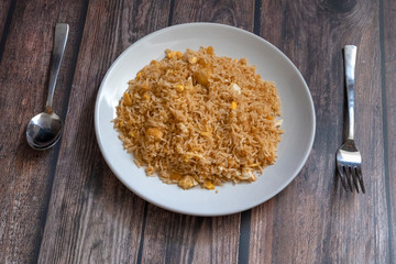 Malaysian traditional fried rice on top of porcelain plate.