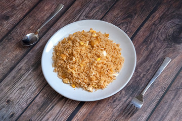 Malaysian traditional fried rice on top of porcelain plate.