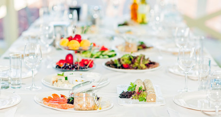 Served tables in restaurants and cafes, meals and drinks on the tables, room design.