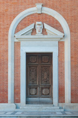 Fototapeta na wymiar Pisa: Church of Santo Stefano dei Cavalieri, side entrance door