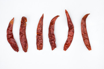 Dried red hot chili pepper isolated on white background. Top view
