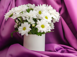 Flowers on the table close-up. White chrysanthemums in a vase