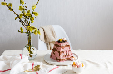 Traditional Easter cottage cheese dessert on the festive table with bouquet of willow. Copy space. Easter card