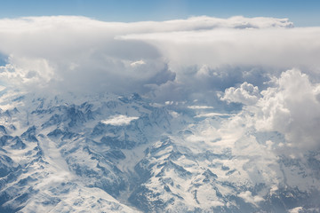 Fototapeta premium Fluffy white clouds, a view from airplane window