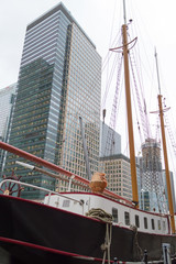 Fototapeta na wymiar A wooden boat at Canary Wharf in London