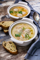 Vertical shot vegetable soup with meatballs. Cabbage, potatoes, carrots and meatballs.