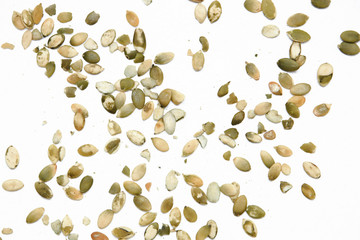Peeled pumpkin seeds isolated on white background.Top view