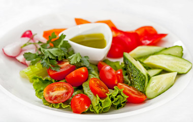 Dish with vegetables. Sliced ​​fresh vegetables.