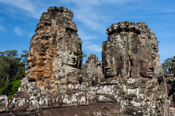 Fototapeta premium The faces are only seen in the Angkor Thom. This big temple is part of the Angkor Wat complex near Siem Reap in Cambodia.