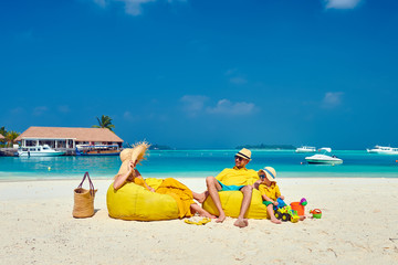 Family with three year old boy on beach
