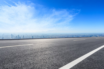 Shanghai city skyline and empty asphalt road scenery,China