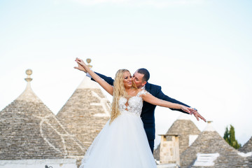 Beautiful wedding couple posing in ancient city