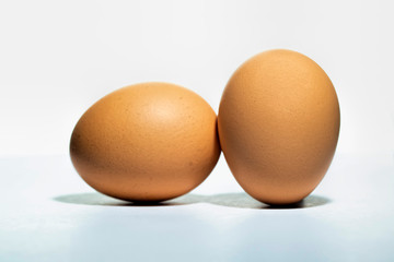 brown chicken egg isolated on white background.  brown oval chicken egg isolated on white background 
