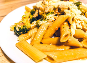 Penne with meat, cheese and green vegetables