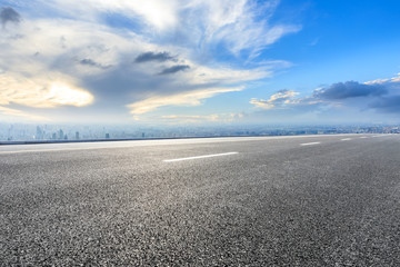 Shanghai city skyline and empty asphalt road scenery at sunrise,China