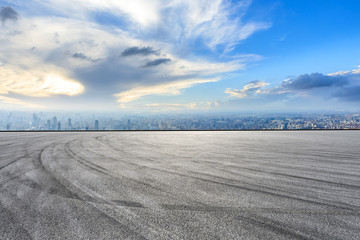 Fototapeta premium Shanghai city skyline and asphalt race track ground scenery,high angle view