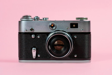 old camera on a pink background