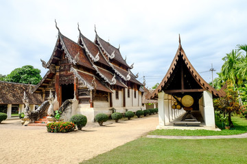 old Buddhist church made from wooden in Northern Thai style, Chiengmai, Thailand 