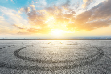 Fototapeta premium Shanghai city skyline and asphalt race track ground at sunrise,high angle view